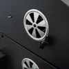 A close-up view of a black grill with silver vents. Podgląd zdjęcia produktu