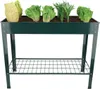 A dark green metal raised garden bed with a wire shelf underneath, filled with various leafy green vegetables. Produktbild-Vorschau