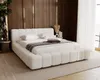 A modern bedroom with a white boucle bed as the focal point, set against a wood-paneled wall. Náhľad obrázku produktu