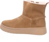 A side view of a brown suede boot with a white fuzzy lining and a thick tan sole. Voir les images du produit