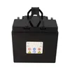 A black battery with a handle on top, shown from the front. Voir les images du produit