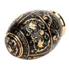 A black and gold decorative egg-shaped object, likely a toothpick holder, against a white background. Náhled obrázku produktu