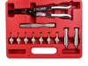 A red plastic case containing a set of valve stem seal pliers and various adapters. Anteprima dell’immagine prodotto
