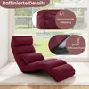 A burgundy floor chair is shown in a room with a large window in the background. Podgląd zdjęcia produktu