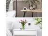 Two split images showing a digital room thermometer/hygrometer on a bedside table and on a white dresser. Podgląd zdjęcia produktu