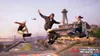 Three skateboarders performing tricks in a skatepark with a lighthouse and bridge in the background. Produktbild-Vorschau