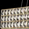 A close-up view of a gold-colored chandelier with many clear crystal elements. Náhľad obrázku produktu