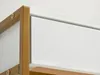 A close-up view of the corner of a desk, showing the junction of a white drawer front and a gold metal frame. Anteprima dell’immagine prodotto