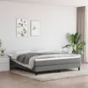 A bedroom scene with a bed, nightstand, and plant. Voir les images du produit