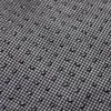 A close-up view of the textured underside of a dog bed, showing small raised dots and water droplets. Náhľad obrázku produktu
