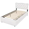 A white upholstered bed frame with a tufted headboard and wooden slats is shown against a white background. Podgląd zdjęcia produktu