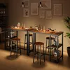 A bar table with stools and drinks set up in a room. Podgląd zdjęcia produktu