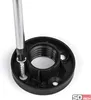A close-up of a black furniture foot being screwed into a black base with a silver screwdriver. Produktbild-Vorschau
