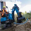 A man operating a mini excavator in an outdoor setting. Produktbild-Vorschau