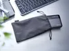 A power bank in a grey pouch next to a keyboard and a tablet. Náhľad obrázku produktu