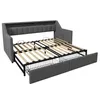 A gray sofa bed with its mattress frame extended, showing the wooden slats and storage drawers underneath. Náhled obrázku produktu