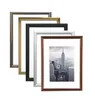 A collection of picture frames of different colors and sizes, arranged diagonally. Produktbild-Vorschau
