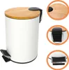 A white pedal bin with a bamboo lid and black pedal, shown from the front-left. Inset images show close-ups of the lid mechanism and the pedal. Produktbild-Vorschau