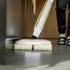 Close-up of a mopping device cleaning a floor. Anteprima dell’immagine prodotto