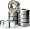A collection of ball bearings stacked and arranged on a white background. Náhľad obrázku produktu