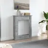 A fireplace surround is shown in a room with a painting above it and a plant to the side. Náhľad obrázku produktu