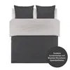 A bed with bedding laid out, showing two pillows and a duvet cover. Voir les images du produit