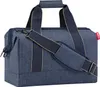 A blue duffel bag with tan accents and a shoulder strap. Voir les images du produit