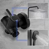 A black shower diverter valve with two inset images showing a rain shower head and a handheld shower head, both spraying water. Anteprima dell’immagine prodotto