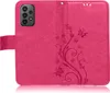 A pink flip case for a smartphone, open to show the inside and the embossed floral pattern. Produktbild-Vorschau