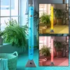 A collage of three images showing a decorative LED water column with artificial fish, illuminated in blue, yellow, and red. Produktbild-Vorschau