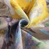 A close-up view of a fabric with a floral pattern, showing the texture and folds of the material. Produktbild-Vorschau