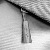 A close-up shot of a zipper pull on a bag, with the brand name 'tomtoc' visible. Produktbild-Vorschau
