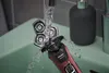A Philips Shaver Series 5000 is being rinsed under running water in a sink. Anteprima dell’immagine prodotto