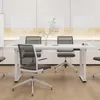 A modern office meeting room with a white table and ergonomic chairs. Náhled obrázku produktu