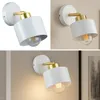A collage of three images showing a modern white and gold wall lamp with a visible light bulb. Náhled obrázku produktu