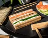 A sushi-making set with ingredients laid out on a black tray. Náhľad obrázku produktu