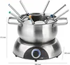 A stainless steel electric fondue set with a black base and a blue control dial, shown with measurement indicators. Produktbild-Vorschau