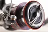 A close-up shot of a fishing reel. Produktbild-Vorschau