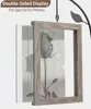A double-sided photo frame with a rose image inside, hanging from a metal tree branch. Produktbild-Vorschau