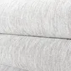 A close-up view of a textured fabric, likely a rug or carpet, folded over itself. Produktbild-Vorschau
