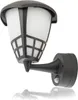 A black outdoor wall lamp with a motion sensor is shown against a white background. Produktbild-Vorschau