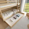 A bunk bed with a pull-out drawer, neatly folded clothes, and a toy monkey in the foreground, with a window and greenery in the background. Produktbild-Vorschau