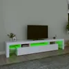 A white TV stand with green LED lighting is shown in a room. Náhled obrázku produktu