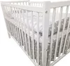 A white wooden crib with gray bedding featuring white stars. Náhled obrázku produktu