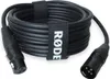 A coiled black audio cable with XLR connectors on both ends, secured by two black Velcro straps. One strap has the RØDE logo in white. Podgląd zdjęcia produktu