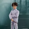 A doll of Harry Potter in pajamas holding a wand. Podgląd zdjęcia produktu