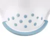 A close-up view of the bottom of a white plastic toddler step stool with light blue polka dots and a light blue rim. Produktbild-Vorschau