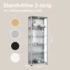 A tall, narrow glass display cabinet with multiple shelves, showcasing various items like glasses, a toy car, and decorative bowls. The cabinet has LED lighting at the top. Color swatches are shown on the left, indicating available finishes. Náhled obrázku produktu