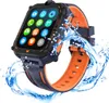 A smartwatch with a black and orange band is shown with water splashing around it. Produktbild-Vorschau