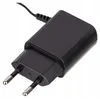 A close-up studio shot of a black power adapter with European-style prongs. Náhľad obrázku produktu